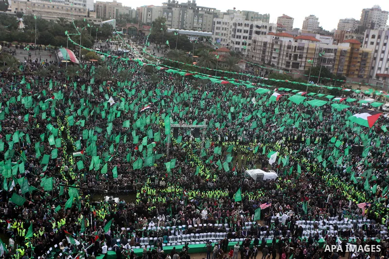 Palestinian Hamas supporters gather to attend a Hamas rally marking the 25th anniversary of the Islamist movement's founding in Gaza City on December 8, 2012. Hamas chief Khaled Meshaal arrived to Gaza strip on December...