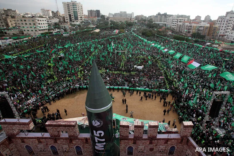 Palestinian Hamas supporters gather to attend a Hamas rally marking the 25th anniversary of the Islamist movement's founding in Gaza City on December 8, 2012. Hamas chief Khaled Meshaal arrived to Gaza strip on December...
