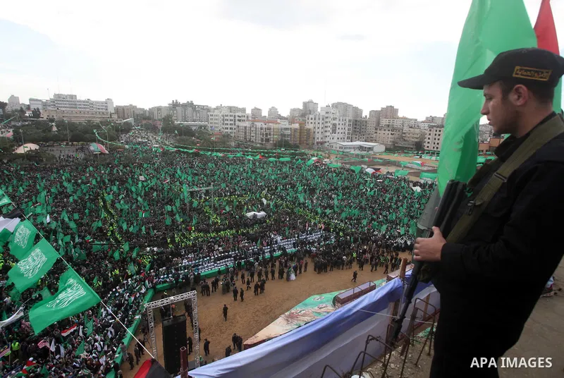 Palestinian Hamas supporters gather to attend a Hamas rally marking the 25th anniversary of the Islamist movement's founding in Gaza City on December 8, 2012. Hamas chief Khaled Meshaal arrived to Gaza strip on December...