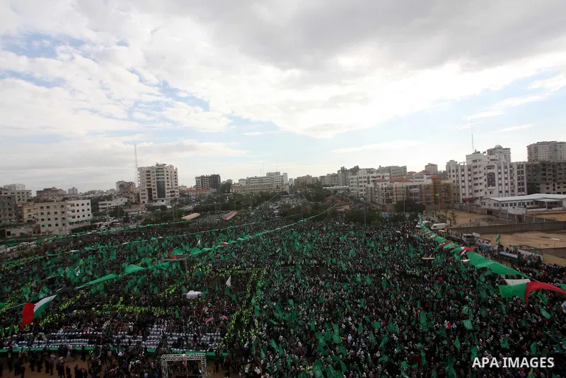 Palestinian Hamas supporters gather to attend a Hamas rally marking the 25th anniversary of the Islamist movement's founding in Gaza City on December 8, 2012. Hamas chief Khaled Meshaal arrived to Gaza strip on December...