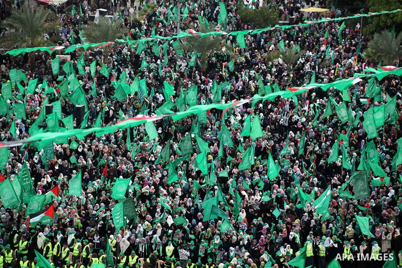 Palestinian Hamas supporters gather to attend a Hamas rally marking the 25th anniversary of the Islamist movement's founding in Gaza City on December 8, 2012. Hamas chief Khaled Meshaal arrived to Gaza strip on December...