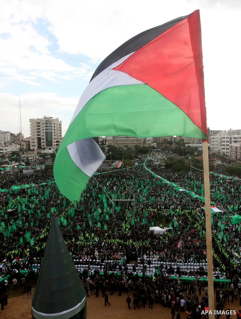 Palestinian Hamas supporters gather to attend a Hamas rally marking the 25th anniversary of the Islamist movement's founding in Gaza City on December 8, 2012. Hamas chief Khaled Meshaal arrived to Gaza strip on December...