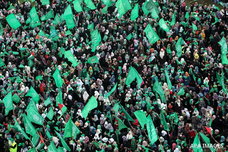 Palestinian Hamas supporters gather to attend a Hamas rally marking the 25th anniversary of the Islamist movement's founding in Gaza City on December 8, 2012. Hamas chief Khaled Meshaal arrived to Gaza strip on December...
