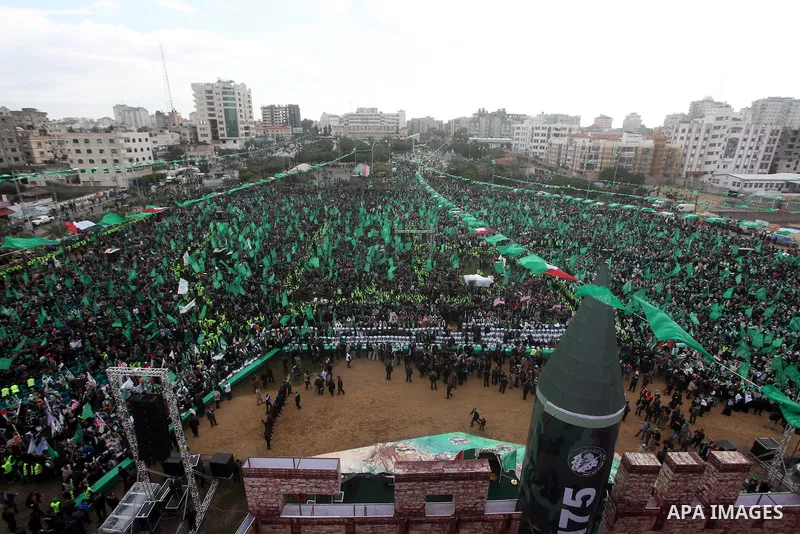 Palestinian Hamas supporters gather to attend a Hamas rally marking the 25th anniversary of the Islamist movement's founding in Gaza City on December 8, 2012. Hamas chief Khaled Meshaal arrived to Gaza strip on December...