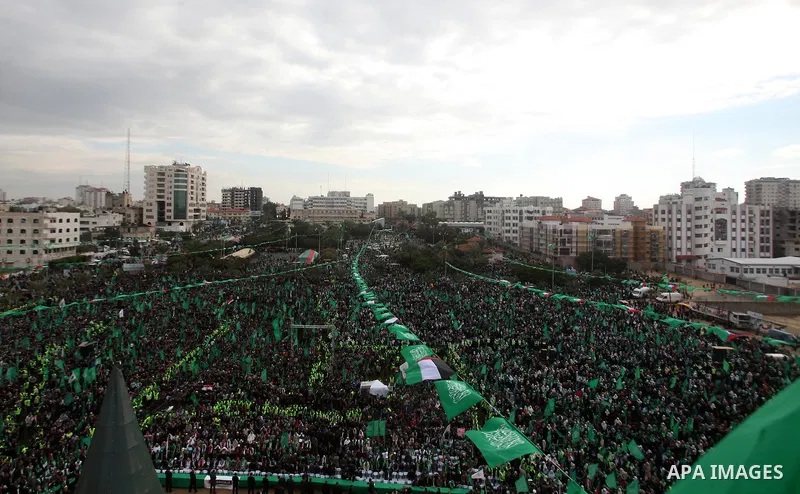 Palestinian Hamas supporters gather to attend a Hamas rally marking the 25th anniversary of the Islamist movement's founding in Gaza City on December 8, 2012. Hamas chief Khaled Meshaal arrived to Gaza strip on December...