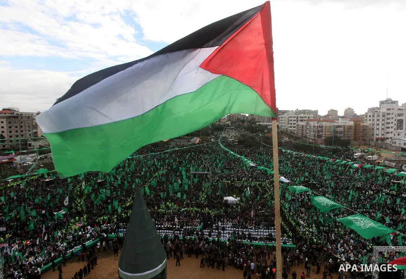 Palestinian Hamas supporters gather to attend a Hamas rally marking the 25th anniversary of the Islamist movement's founding in Gaza City on December 8, 2012. Hamas chief Khaled Meshaal arrived to Gaza strip on December...