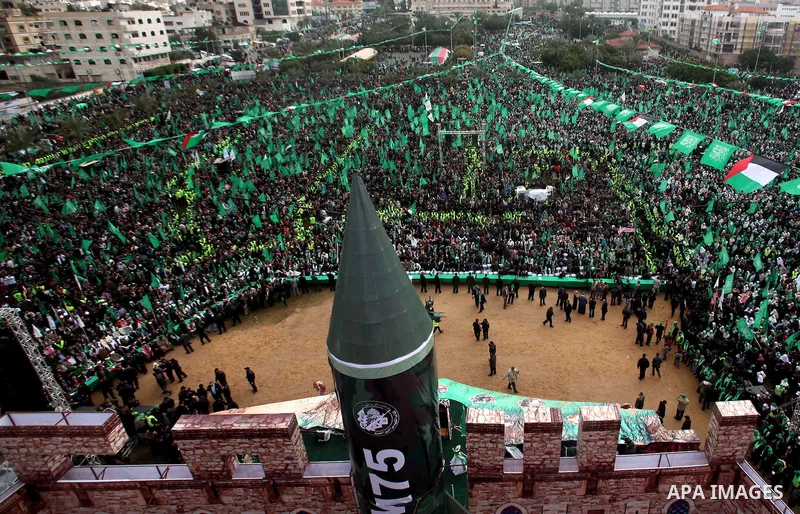 Palestinian Hamas supporters gather to attend a Hamas rally marking the 25th anniversary of the Islamist movement's founding in Gaza City on December 8, 2012. Hamas chief Khaled Meshaal arrived to Gaza strip on December...