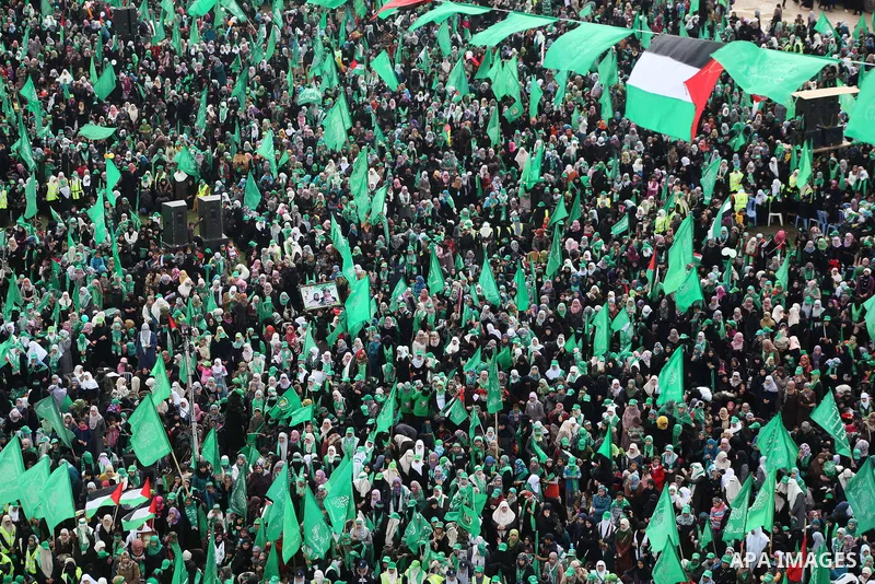 Palestinian Hamas supporters gather to attend a Hamas rally marking the 25th anniversary of the Islamist movement's founding in Gaza City on December 8, 2012. Hamas chief Khaled Meshaal arrived to Gaza strip on December...