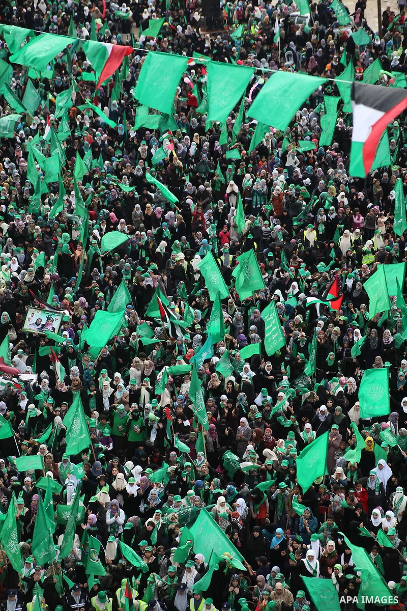 Palestinian Hamas supporters gather to attend a Hamas rally marking the 25th anniversary of the Islamist movement's founding in Gaza City on December 8, 2012. Hamas chief Khaled Meshaal arrived to Gaza strip on December...