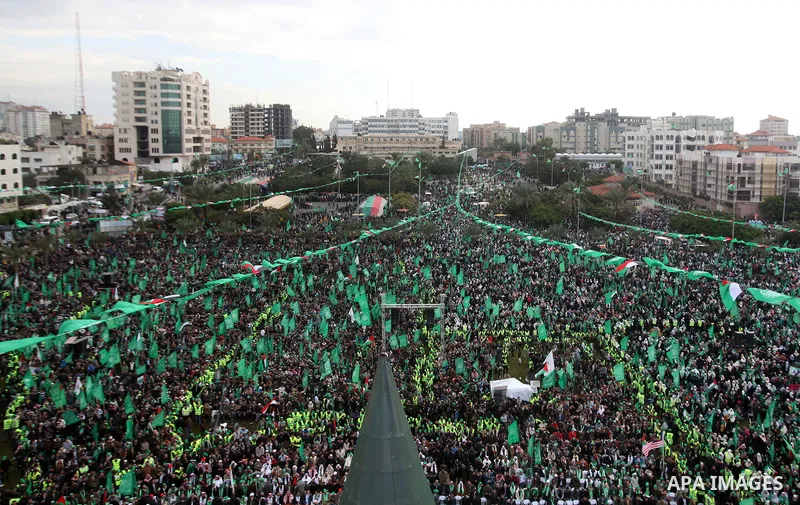 Palestinian Hamas supporters gather to attend a Hamas rally marking the 25th anniversary of the Islamist movement's founding in Gaza City on December 8, 2012. Hamas chief Khaled Meshaal arrived to Gaza strip on December...