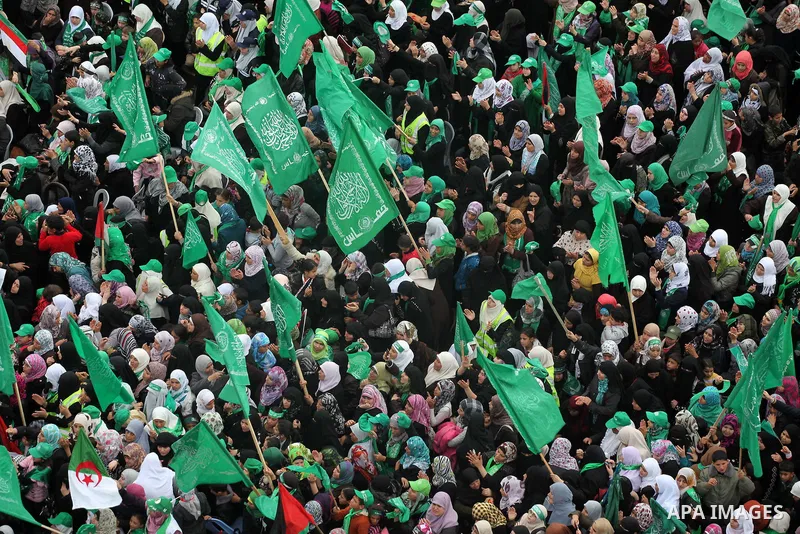 Palestinian Hamas supporters gather to attend a Hamas rally marking the 25th anniversary of the Islamist movement's founding in Gaza City on December 8, 2012. Hamas chief Khaled Meshaal arrived to Gaza strip on December...