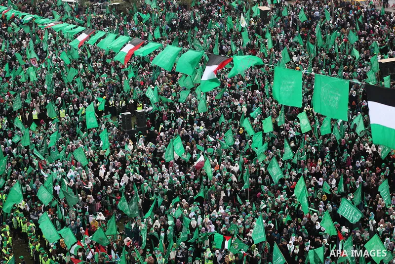Palestinian Hamas supporters gather to attend a Hamas rally marking the 25th anniversary of the Islamist movement's founding in Gaza City on December 8, 2012. Hamas chief Khaled Meshaal arrived to Gaza strip on December...