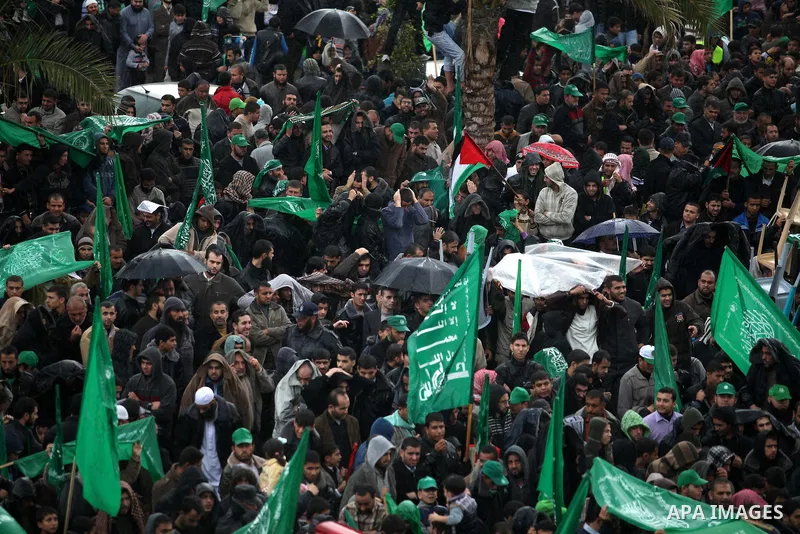 Palestinian Hamas supporters attend a Hamas rally marking the 25th anniversary of the Islamist movement's founding in Gaza City on December 8, 2012. Hamas chief Khaled Meshaal arrived to Gaza strip on December 7 during h...