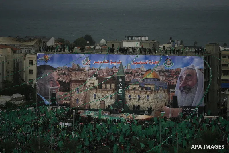 Palestinian Hamas supporters attend a Hamas rally marking the 25th anniversary of the Islamist movement's founding in Gaza City on December 8, 2012. Hamas chief Khaled Meshaal arrived to Gaza strip on December 7 during h...