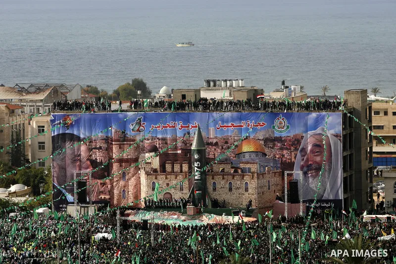 Palestinian Hamas supporters attend a Hamas rally marking the 25th anniversary of the Islamist movement's founding in Gaza City on December 8, 2012. Hamas chief Khaled Meshaal arrived to Gaza strip on December 7 during h...