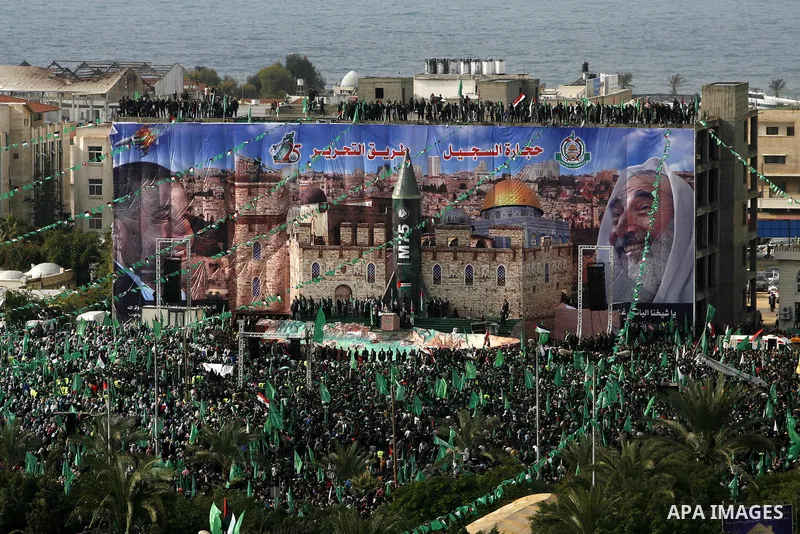 Palestinian Hamas supporters attend a Hamas rally marking the 25th anniversary of the Islamist movement's founding in Gaza City on December 8, 2012. Hamas chief Khaled Meshaal arrived to Gaza strip on December 7 during h...