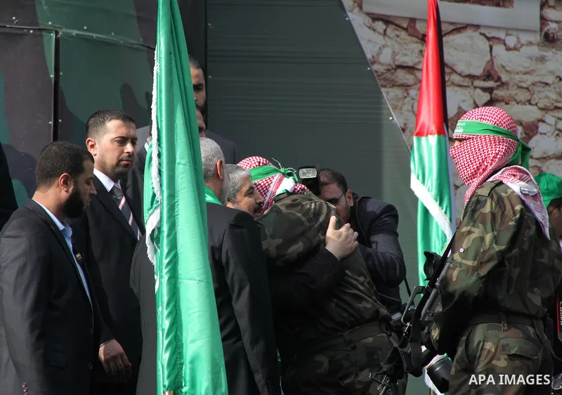 Hamas chief Khaled Meshaal, with senior Hamas leaders, takes part in a Hamas rally marking the 25th anniversary of the Islamist movement's founding in Gaza City on December 8, 2012. Meshaal arrived to Gaza strip on Decem...