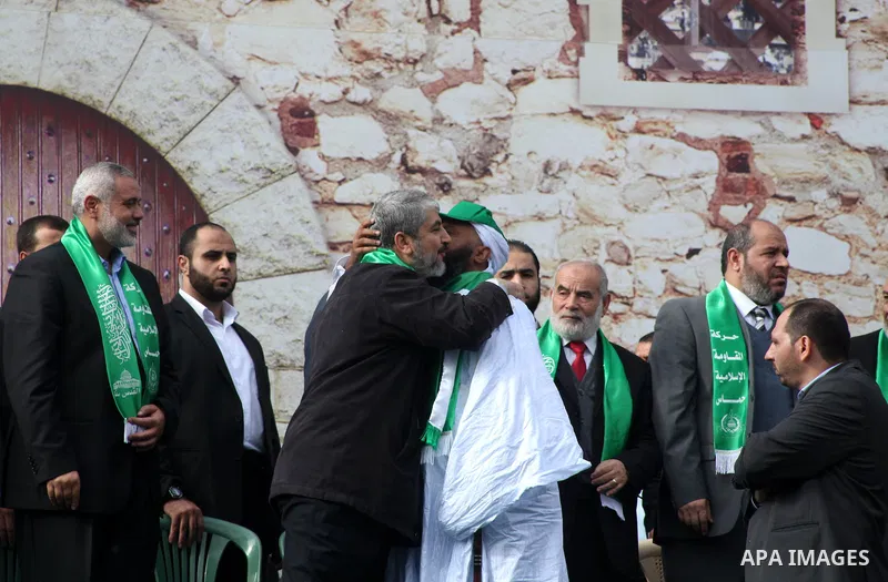 Hamas chief Khaled Meshaal, with senior Hamas leaders, takes part in a Hamas rally marking the 25th anniversary of the Islamist movement's founding in Gaza City on December 8, 2012. Meshaal arrived to Gaza strip on Decem...