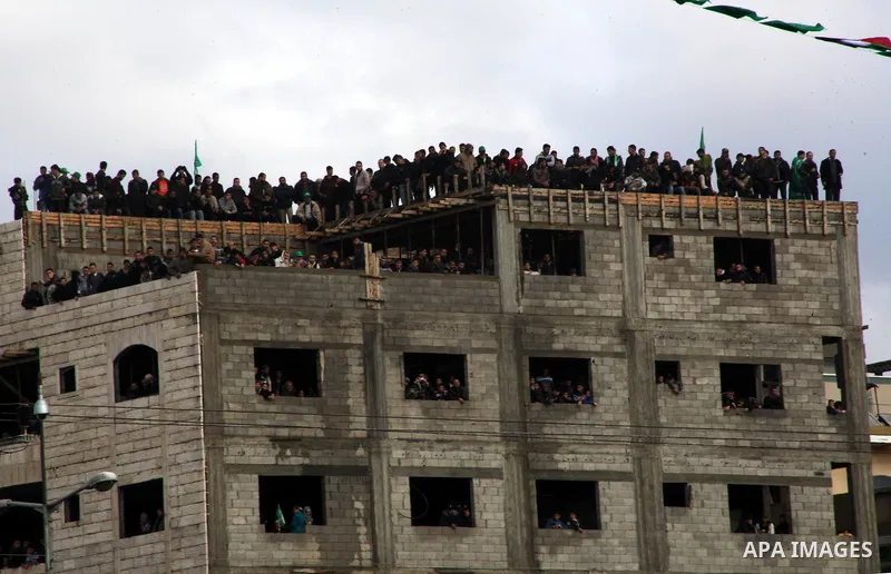 Palestinian Hamas supporters gather to attend a Hamas rally marking the 25th anniversary of the Islamist movement's founding in Gaza City on December 8, 2012. Hamas chief Khaled Meshaal arrived to Gaza strip on December...