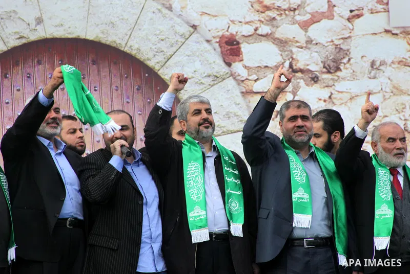 Hamas chief Khaled Meshaal, with senior Hamas leaders, takes part in a Hamas rally marking the 25th anniversary of the Islamist movement's founding in Gaza City on December 8, 2012. Meshaal arrived to Gaza strip on Decem...