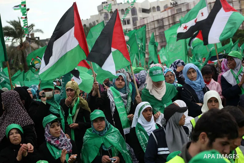 Palestinian Hamas supporters attend a Hamas rally marking the 25th anniversary of the Islamist movement's founding in Gaza City on December 8, 2012. Hamas chief Khaled Meshaal arrived to Gaza strip on December 7 during h...