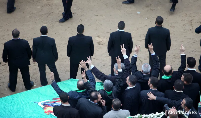 Hamas chief Khaled Meshaal, with senior Hamas leaders, takes part in a Hamas rally marking the 25th anniversary of the Islamist movement's founding in Gaza City on December 8, 2012. Meshaal arrived to Gaza strip on Decem...