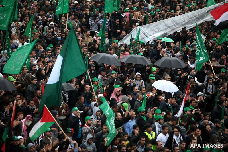 Palestinian Hamas supporters attend a Hamas rally marking the 25th anniversary of the Islamist movement's founding in Gaza City on December 8, 2012. Hamas chief Khaled Meshaal arrived to Gaza strip on December 7 during h...