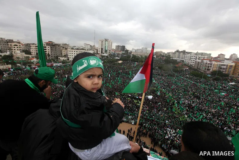 Palestinian Hamas supporters attend a Hamas rally marking the 25th anniversary of the Islamist movement's founding in Gaza City on December 8, 2012. Hamas chief Khaled Meshaal arrived to Gaza strip on December 7 during h...