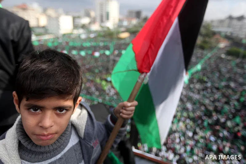 Palestinian Hamas supporters attend a Hamas rally marking the 25th anniversary of the Islamist movement's founding in Gaza City on December 8, 2012. Hamas chief Khaled Meshaal arrived to Gaza strip on December 7 during h...