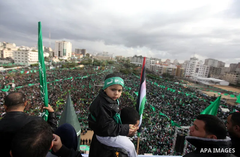 Palestinian Hamas supporters attend a Hamas rally marking the 25th anniversary of the Islamist movement's founding in Gaza City on December 8, 2012. Hamas chief Khaled Meshaal arrived to Gaza strip on December 7 during h...