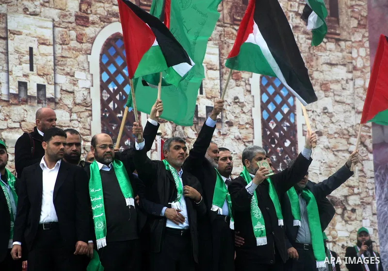 Hamas chief Khaled Meshaal, with senior Hamas leaders, takes part in a Hamas rally marking the 25th anniversary of the Islamist movement's founding in Gaza City on December 8, 2012. Meshaal arrived to Gaza strip on Decem...