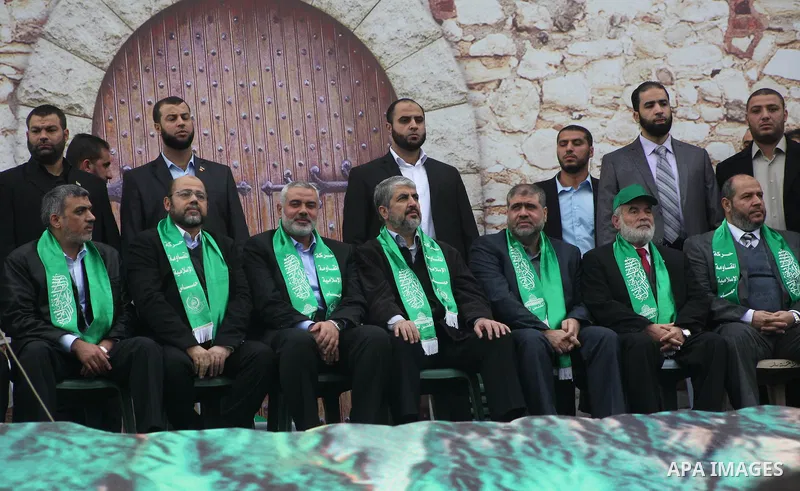 Hamas chief Khaled Meshaal, with senior Hamas leaders, takes part in a Hamas rally marking the 25th anniversary of the Islamist movement's founding in Gaza City on December 8, 2012. Meshaal arrived to Gaza strip on Decem...