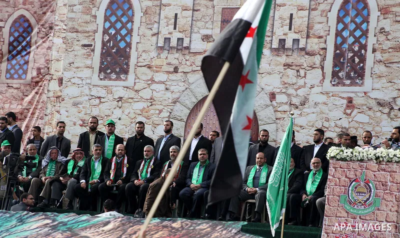 Hamas chief Khaled Meshaal, with senior Hamas leaders, takes part in a Hamas rally marking the 25th anniversary of the Islamist movement's founding in Gaza City on December 8, 2012. Meshaal arrived to Gaza strip on Decem...