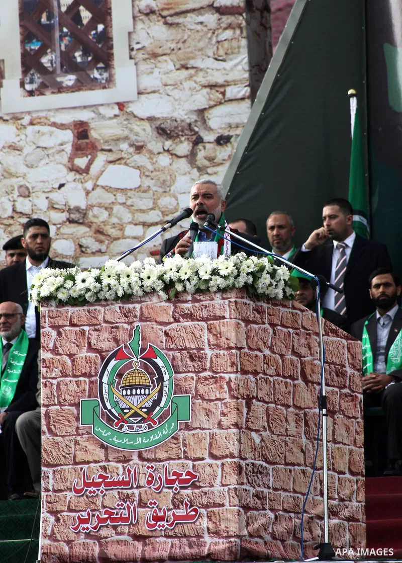 Palestinian prime minister in Gaza Strip, Ismail Haniyah speaks during a Hamas rally marking the 25th anniversary of the Islamist movement's founding in Gaza City on December 8, 2012. Meshaal arrived to Gaza strip on Dec...