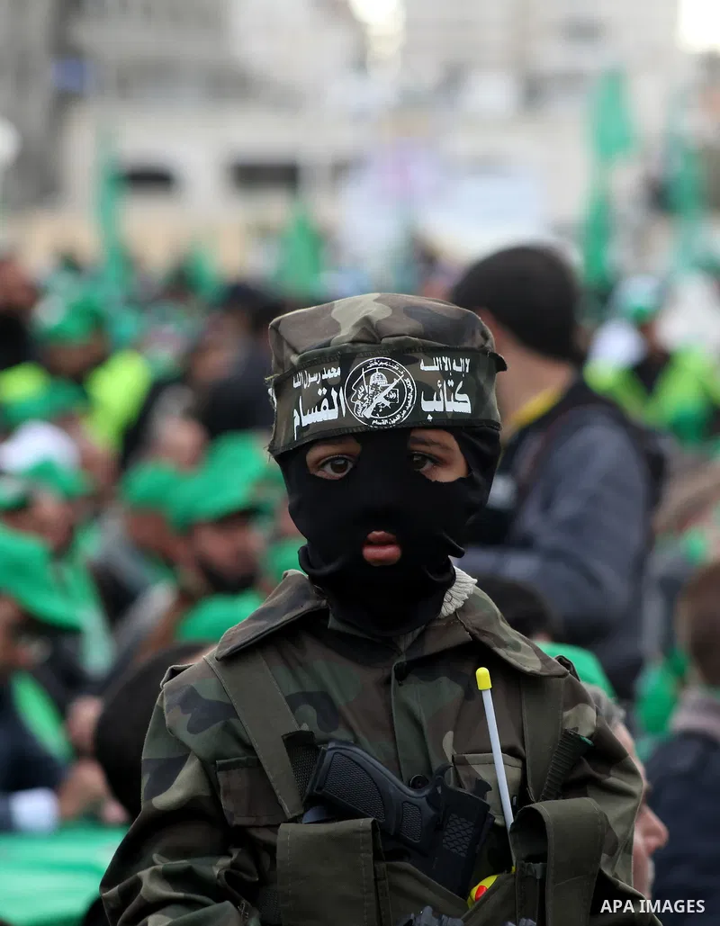 Palestinian Hamas supporters attend a Hamas rally marking the 25th anniversary of the Islamist movement's founding in Gaza City on December 8, 2012. Hamas chief Khaled Meshaal arrived to Gaza strip on December 7 during h...