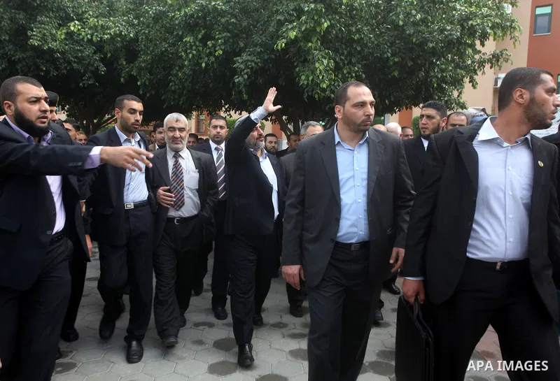 Hamas chief Khaled Meshaal, is greeted during his visit to the Islamic University in Gaza City December 9, 2012. Meshaal, in a defiant speech during his first ever visit to Gaza, told a mass rally on Saturday he would ne...