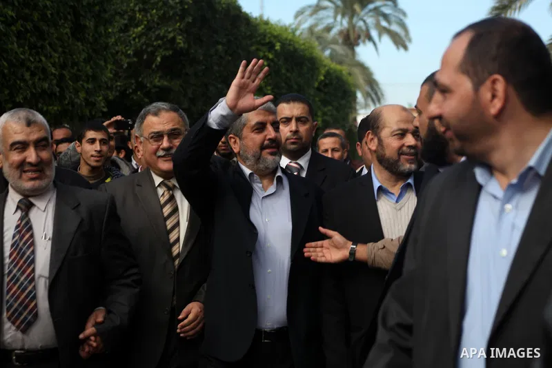 Hamas chief in exile Khaled Meshaal, waves at supporters during a visit to the Islamic University in Gaza City on December 9, 2012. Meshaal rejected ceding "an inch" of Palestinian territory to Israel or recognising the...