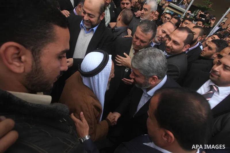 Hamas chief in exile Khaled Meshaal, waves at supporters during a visit to the Islamic University in Gaza City on December 9, 2012. Meshaal rejected ceding "an inch" of Palestinian territory to Israel or recognising the...