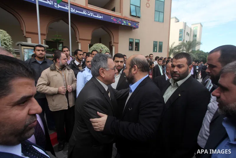 Hamas chief in exile Khaled Meshaal, waves at supporters during a visit to the Islamic University in Gaza City on December 9, 2012. Meshaal rejected ceding "an inch" of Palestinian territory to Israel or recognising the...