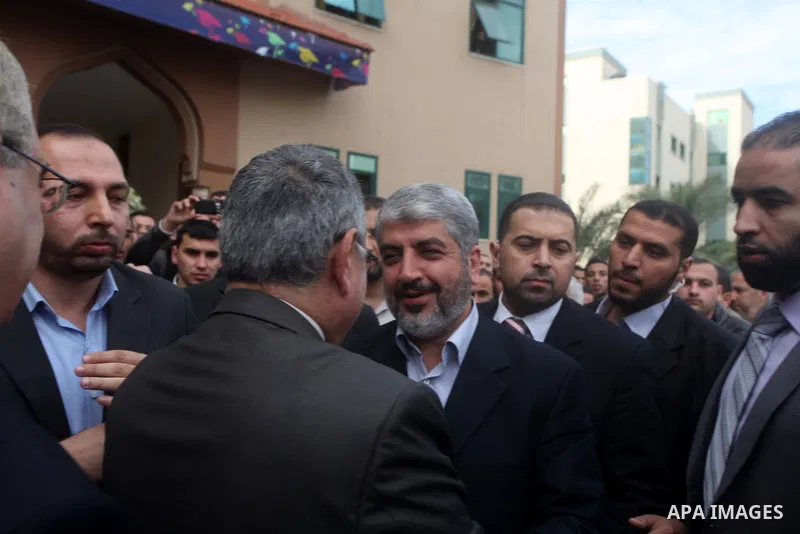 Hamas chief in exile Khaled Meshaal, waves at supporters during a visit to the Islamic University in Gaza City on December 9, 2012. Meshaal rejected ceding "an inch" of Palestinian territory to Israel or recognising the...