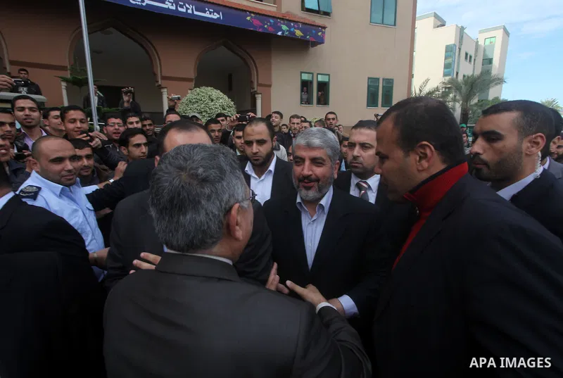 Hamas chief in exile Khaled Meshaal, waves at supporters during a visit to the Islamic University in Gaza City on December 9, 2012. Meshaal rejected ceding "an inch" of Palestinian territory to Israel or recognising the...