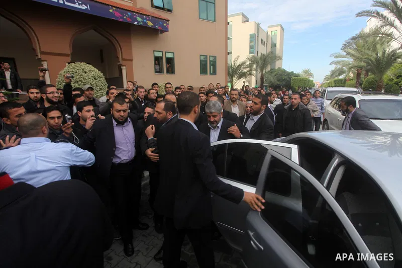Hamas chief in exile Khaled Meshaal, waves at supporters during a visit to the Islamic University in Gaza City on December 9, 2012. Meshaal rejected ceding "an inch" of Palestinian territory to Israel or recognising the...