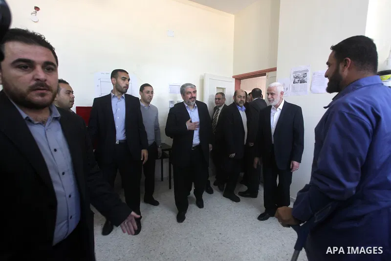 Hamas chief Khaled Meshaal, is greeted during his visit to a project funded by the Turkish President ragab ardogan in the Islamic University in Gaza City December 9, 2012. Meshaal, in a defiant speech during his first ev...