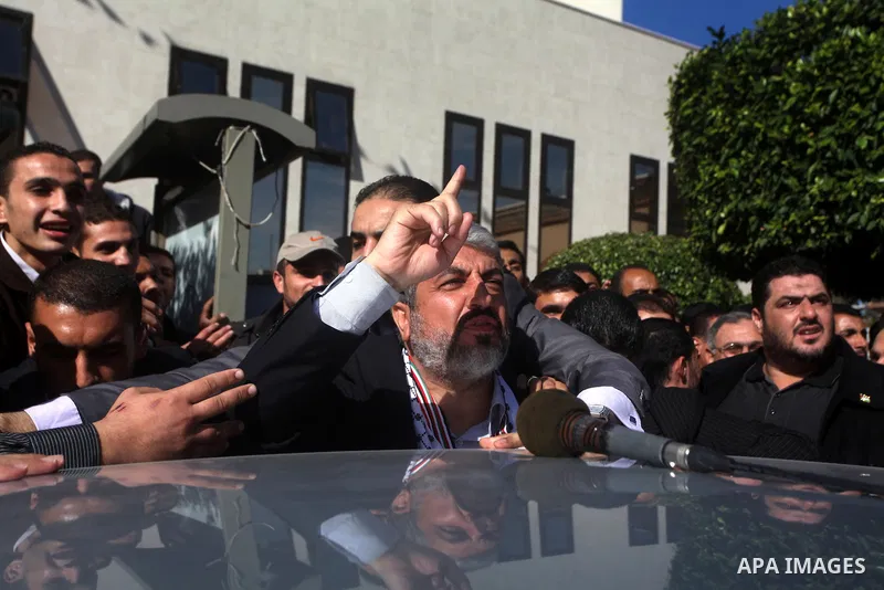 Hamas chief in exile Khaled Meshaal, waves at supporters during a visit to the Islamic University in Gaza City on December 9, 2012. Meshaal rejected ceding "an inch" of Palestinian territory to Israel or recognising the...