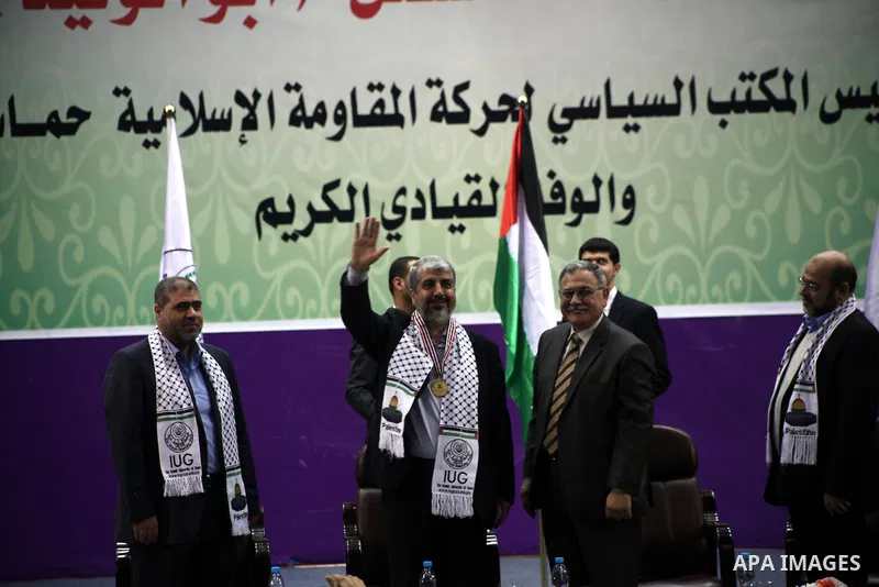 Hamas chief in exile Khaled Meshaal, waves at supporters during a visit to the Islamic University in Gaza City on December 9, 2012. Meshaal rejected ceding "an inch" of Palestinian territory to Israel or recognising the...