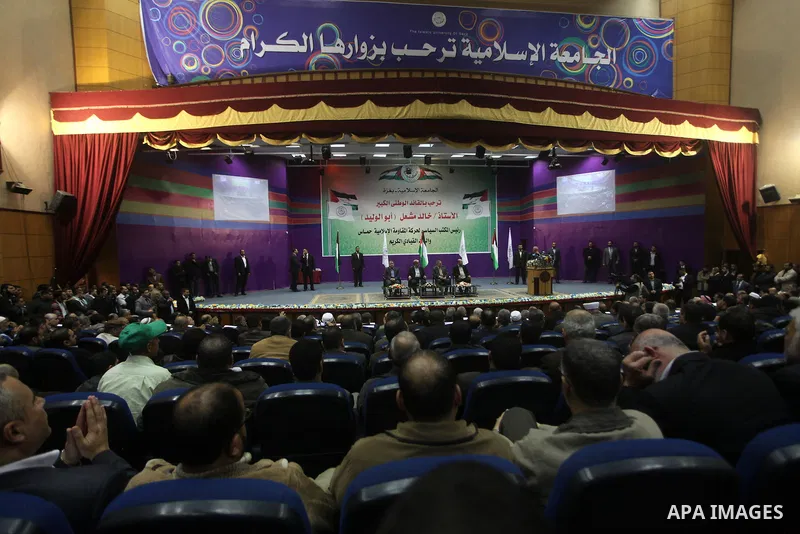 Hamas chief in exile Khaled Meshaal, waves at supporters during a visit to the Islamic University in Gaza City on December 9, 2012. Meshaal rejected ceding "an inch" of Palestinian territory to Israel or recognising the...