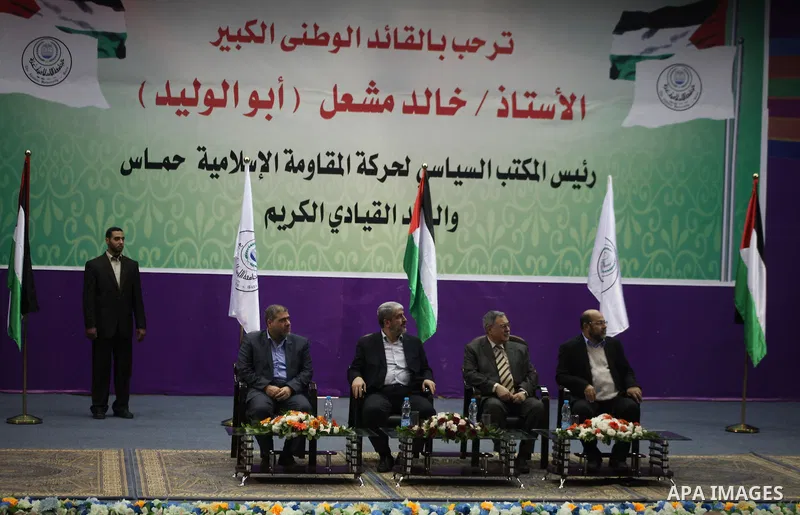 Hamas chief in exile Khaled Meshaal, waves at supporters during a visit to the Islamic University in Gaza City on December 9, 2012. Meshaal rejected ceding "an inch" of Palestinian territory to Israel or recognising the...