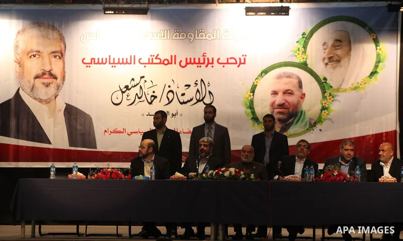 Hamas chief Khaled Meshaal, attends a meeting with the relatives of Palestinian prisoners in Israeli jails in Gaza City December 9, 2012. Meshaal, in a defiant speech during his first ever visit to Gaza, told a mass rall...