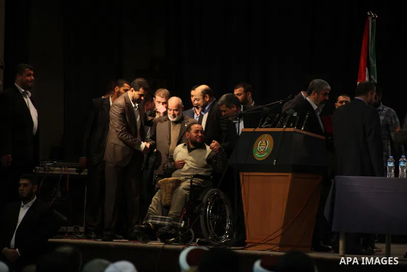 Hamas chief Khaled Meshaal, speaks during a meeting with the relatives of Palestinian prisoners in Israeli jails in Gaza City December 9, 2012. Meshaal, in a defiant speech during his first ever visit to Gaza, told a mas...