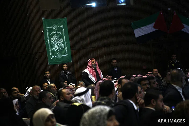 Hamas chief Khaled Meshaal (not seen), attends a meeting with the relatives of Palestinian prisoners in Israeli jails in Gaza City December 9, 2012. Meshaal, in a defiant speech during his first ever visit to Gaza, told...